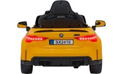 Электромобиль BMW M4, жёлтый