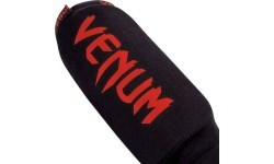 Venum Kontact blauzdų apsaugos, juodos/raudonos