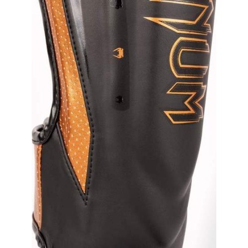 Venum Elite Evo blauzdų apsaugos, juoda/bronzinė