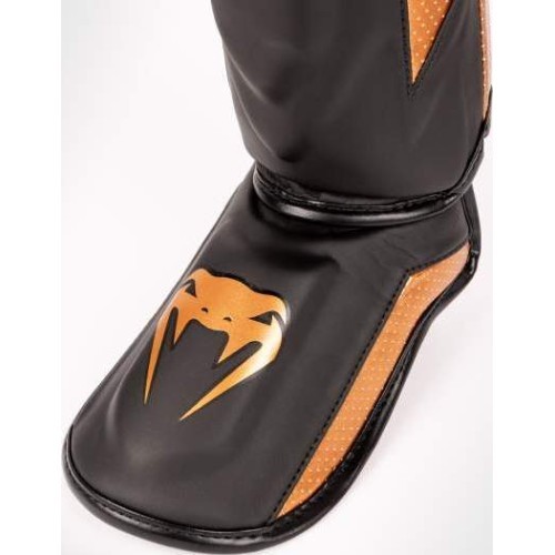 Venum Elite Evo blauzdų apsaugos, juoda/bronzinė